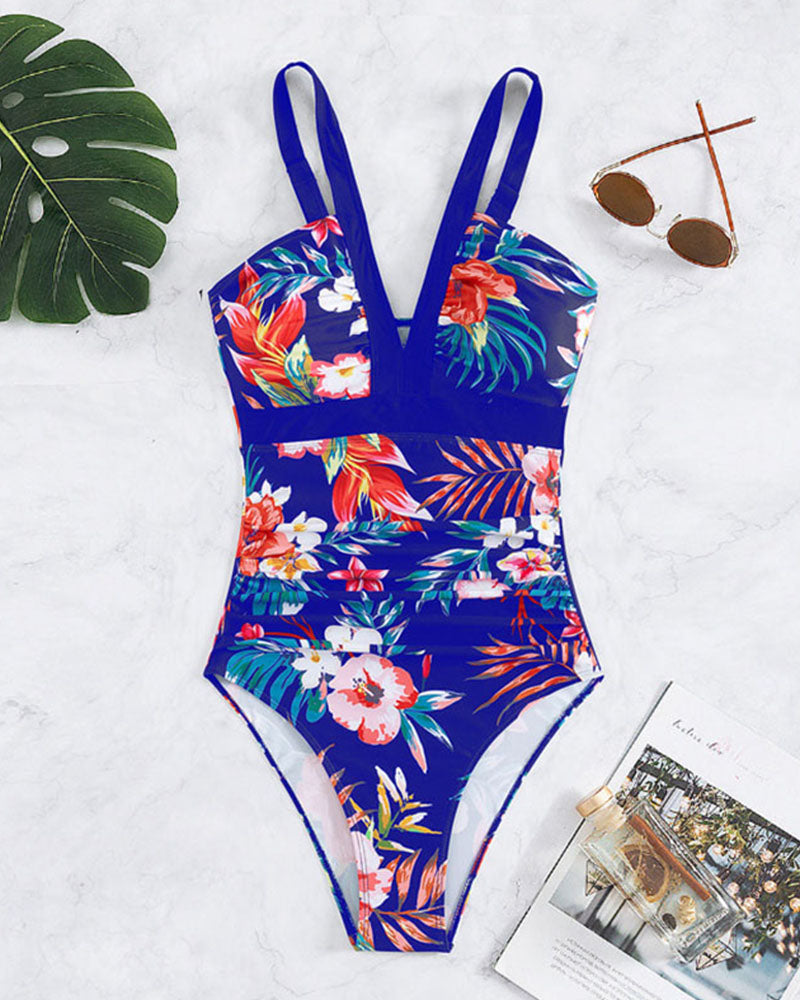 Schicker Damen Badeanzug mit detailreicher Raffung und ansprechendem Blumenmuster, ideal für Strand und Pool.
