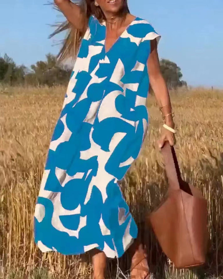 Buntes, bedrucktes Damen Maxikleid mit V-Ausschnitt, ideal als luftiges Sommerkleid oder elegantes Strandkleid.