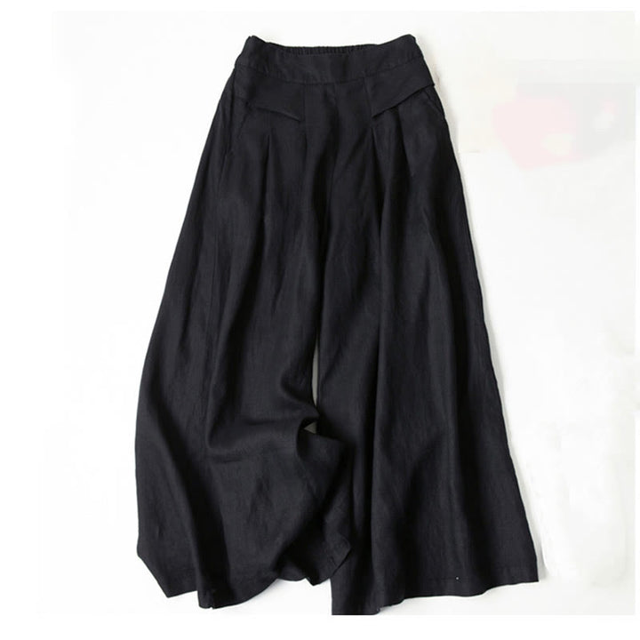 Vielseitige Damenhose mit weitem Bein, hoher Taille und bequemem Elastikbund. Lässige Eleganz für den Herbst.