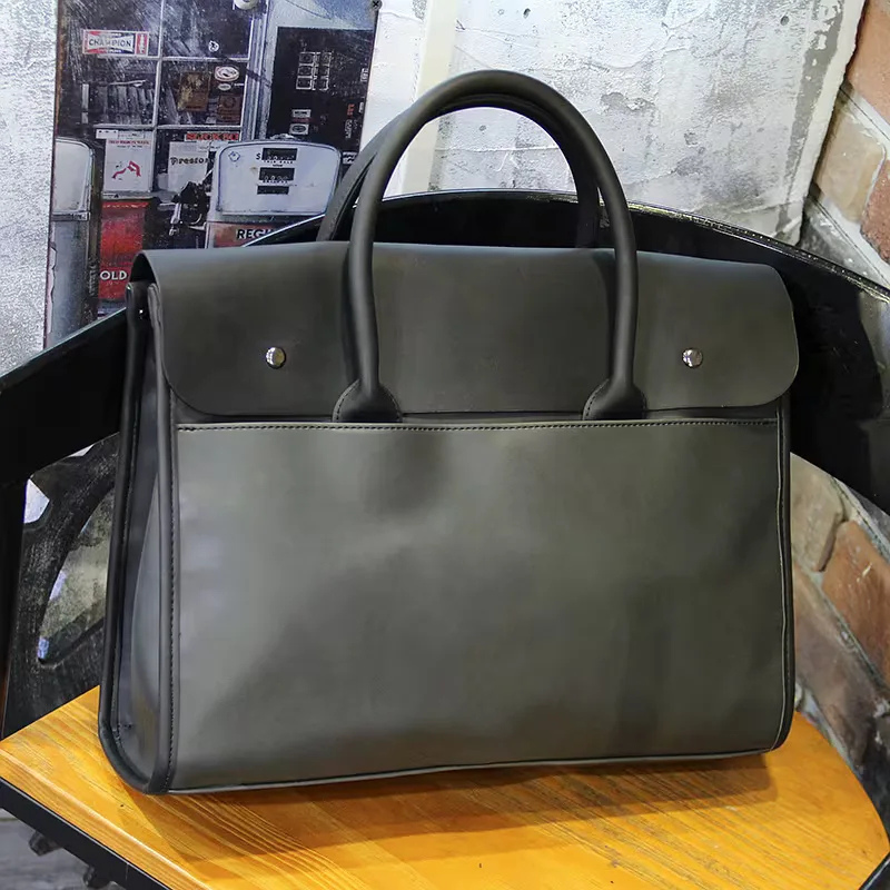 Elegante graue Leder Aktentasche für Herren, als Businesstasche mit abnehmbarem Schulterriemen.
