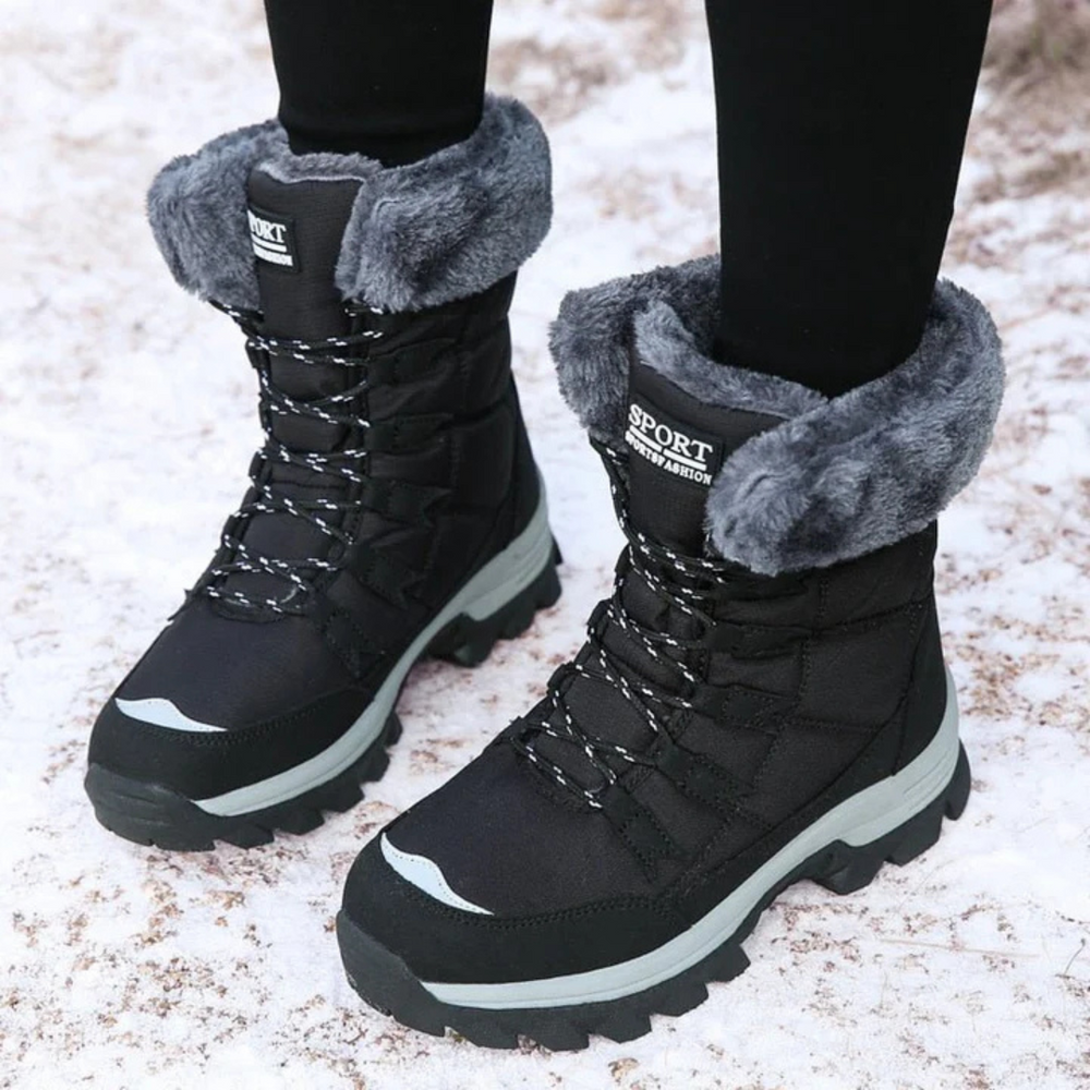 Stylische, wasserdichte Damen Winterstiefel in Schwarz, warm gefüttert und rutschfest.