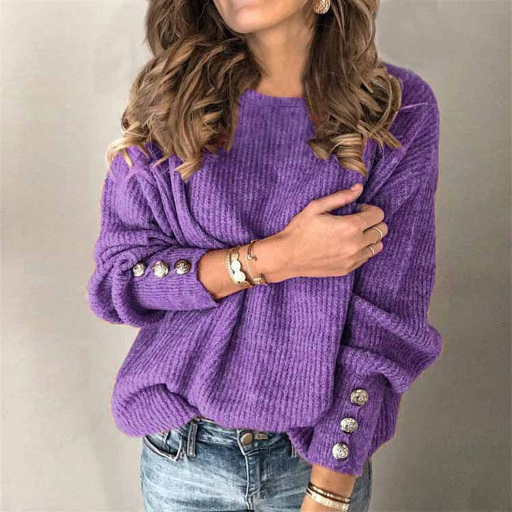 Grauer Damenpullover mit langen Ärmeln und eleganten Knopfdetails, vielseitig kombinierbar.