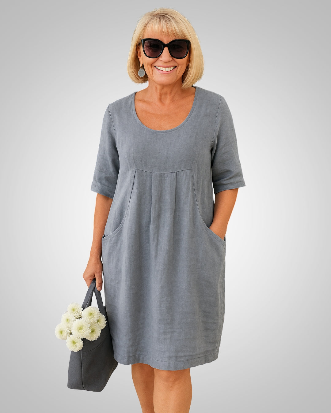 Damen Kurzarm Sommerkleid mit praktischen Taschen & Rundhals. Bequem & locker geschnitten für den Alltag.