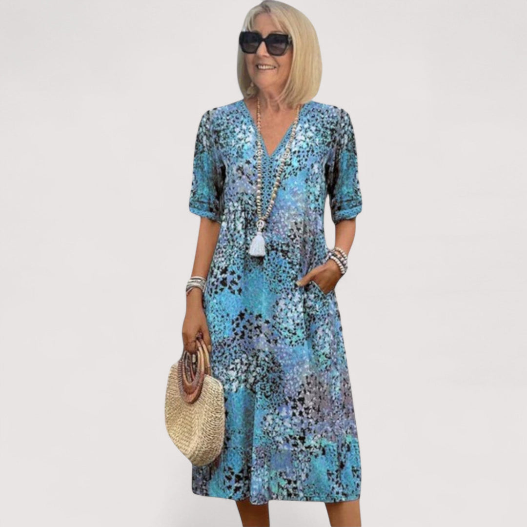 Atmungsaktives Damen Sommerkleid mit praktischen Taschen, Kurzarm und lockerer Passform für heiße Tage.
