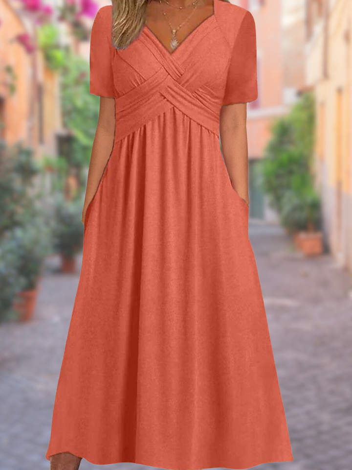 Damen Sommer Midikleid in A-Linie mit tiefem V-Ausschnitt, elegantem Kreuzrücken und praktischen Seiten-Taschen.