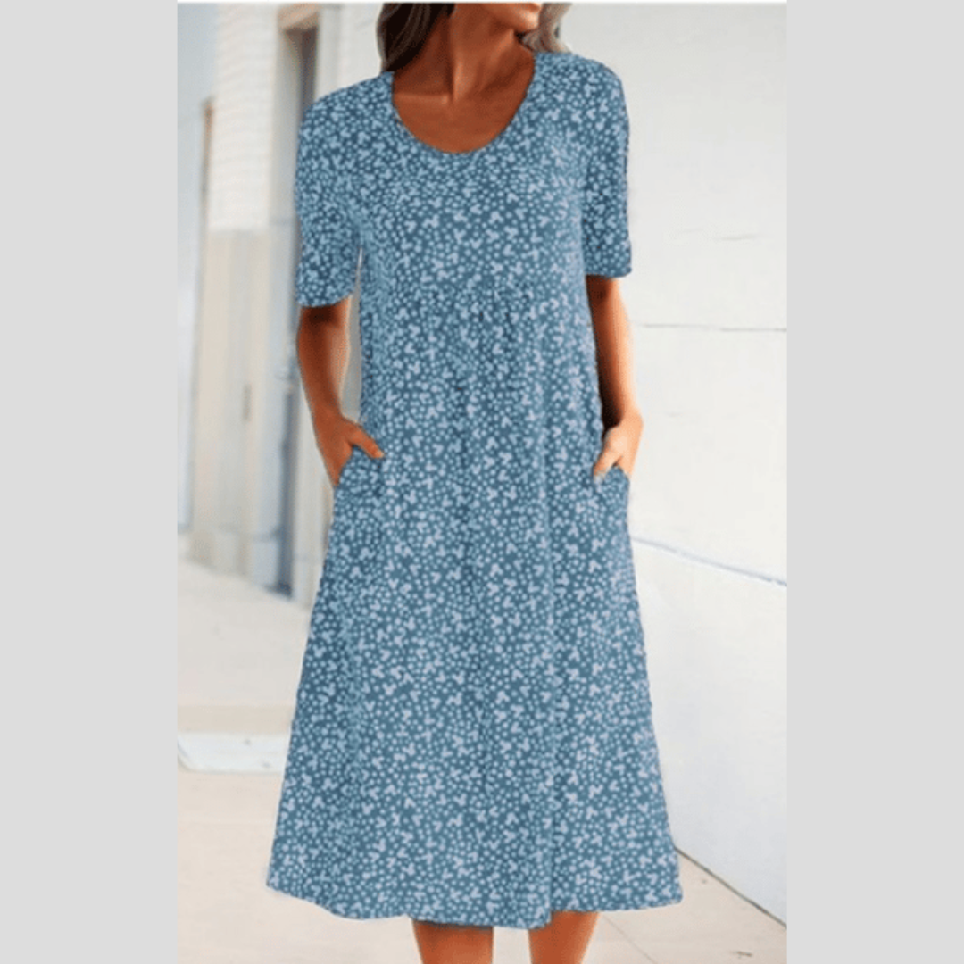 Vielseitiges Blumen-Midikleid für Damen. Sonniges Design, Kurzarm und praktische Taschen. Perfekt für den Sommer.