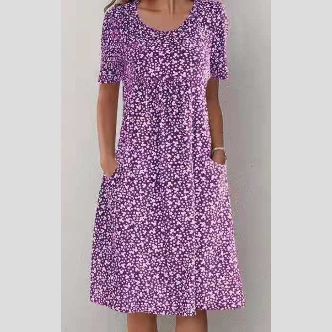 Damen Sonnentanz Midikleid mit farbenfrohem Blumenprint, Kurzarm und eleganter A-Linien-Silhouette. Ein Must-Have.
