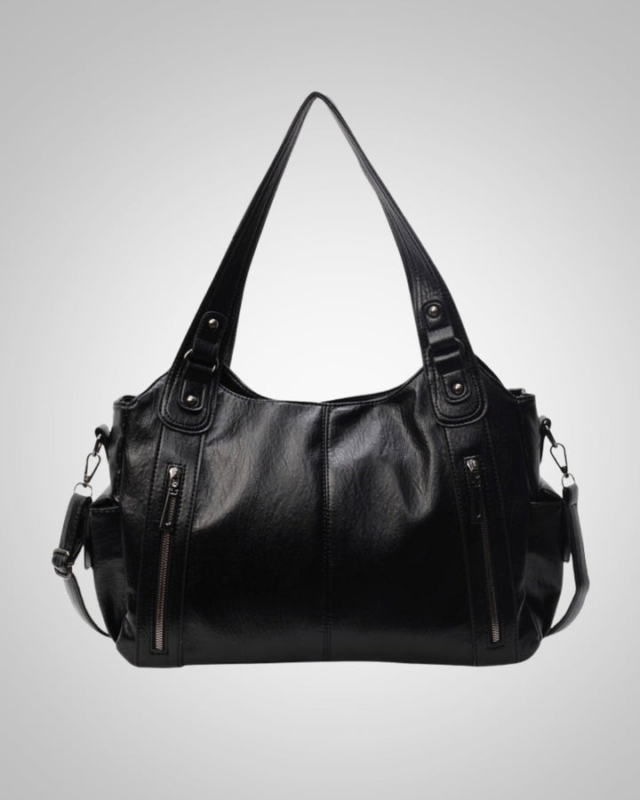 Schwarze Damentasche, vielseitig als Reisetasche, Schultertasche & Sporttasche nutzbar.