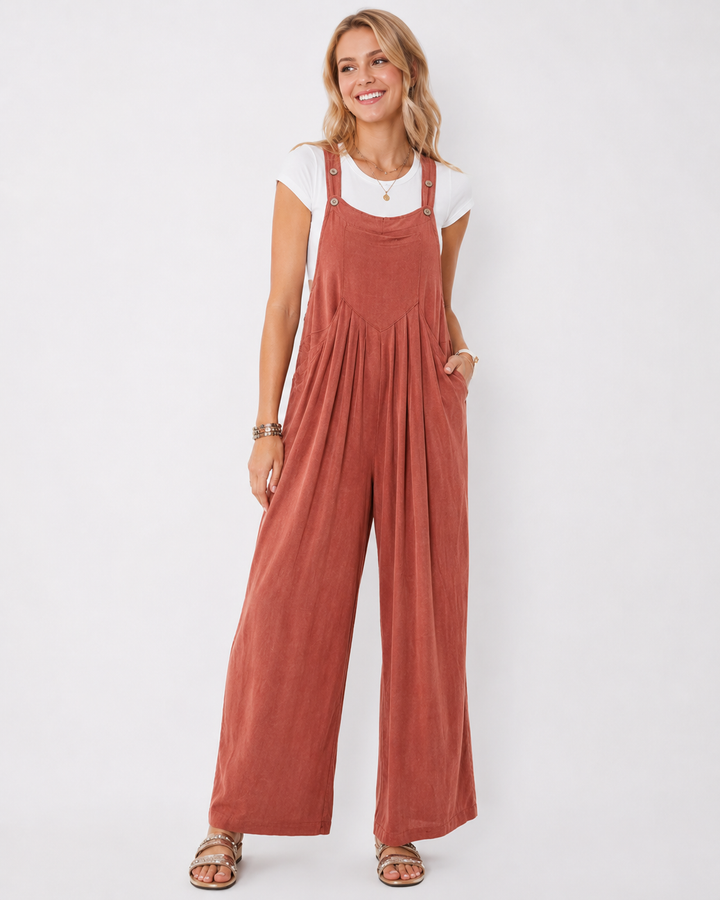 Moderner Damen Jumpsuit mit weitem Bein. Lockere Passform, einfarbig, ideal als bequemes Sommeroutfit.