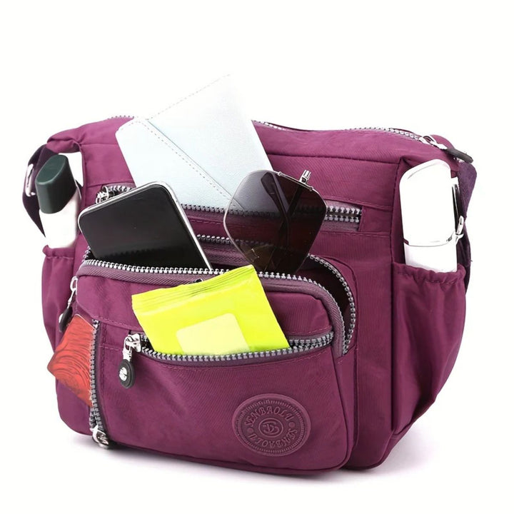 Damentasche mit viel Platz für Essentials, inklusive Handyfach und Reißverschlussfächern für beste Organisation.