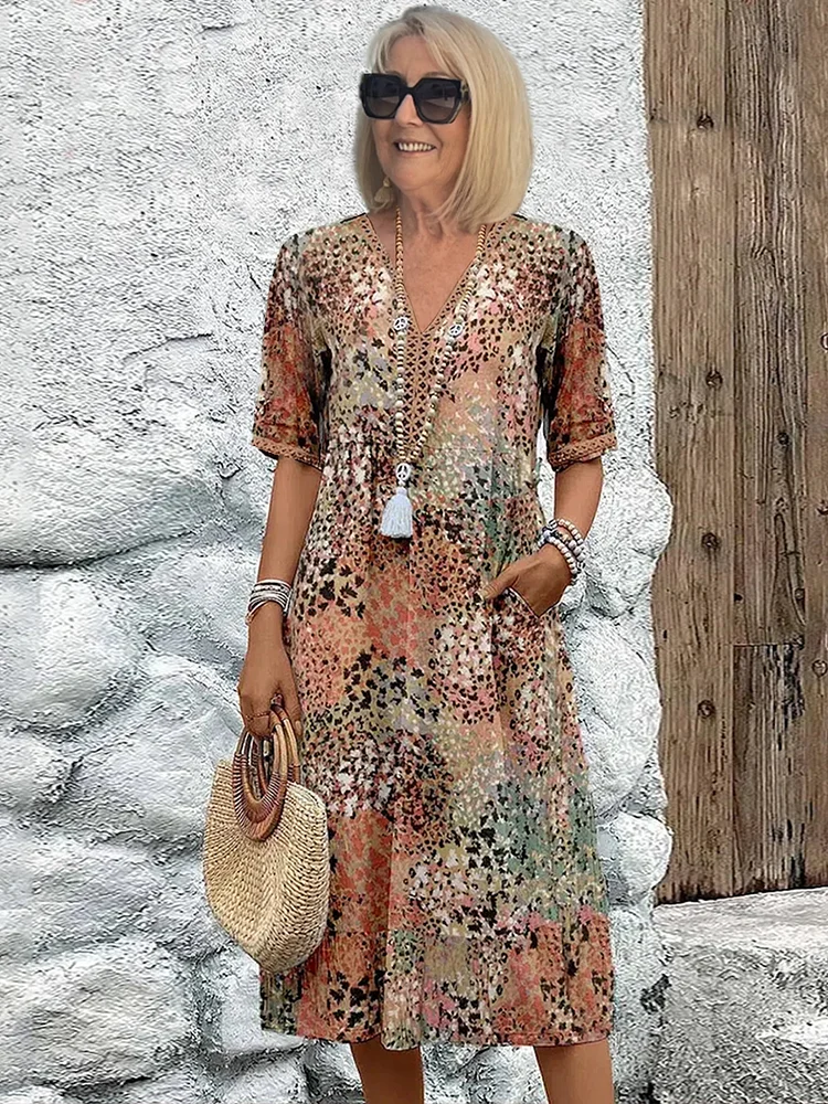 Damen Blumen Midikleid mit V-Ausschnitt und fließender A-Linie für sommerliche Eleganz.