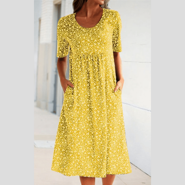 Bequemes Damen Midikleid mit schmeichelnder Passform, A-Linie und lebendigem Blumenmuster. Ideal als Freizeitkleid.
