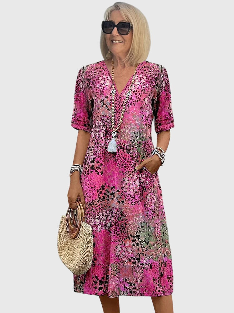 Figurschmeichelndes Damen Midikleid in elegantem Blumendesign, zeitlos & chic für jede moderne Frau.