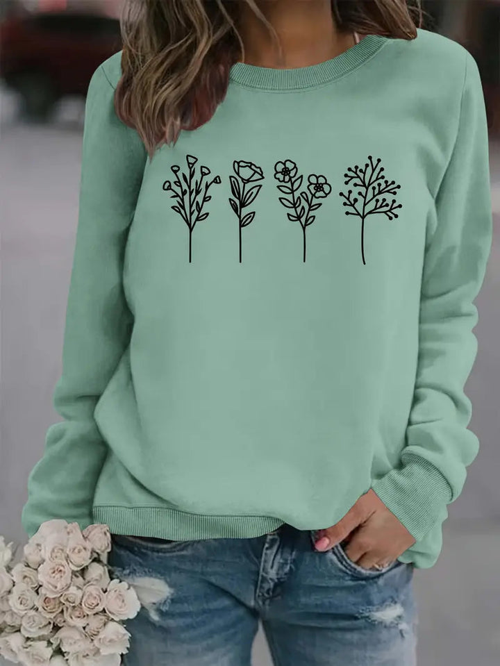 Grünes Damen Sweatshirt mit stilvollem Blumenmuster für Herbst & Winter. Rundhals, Langarm, bequem & casual.