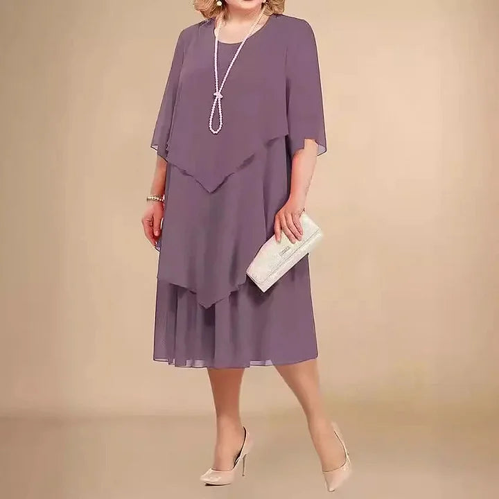 Modernes Damen Midikleid, asymmetrischer Saum, Kurzarm, Rundhals & fließendes Material; chic & bequem.