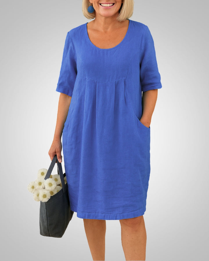 Vielseitiges Damen Kurzarm Sommerkleid mit Rundhals & praktischen Taschen. Locker geschnittenes Alltagskleid, bequem.