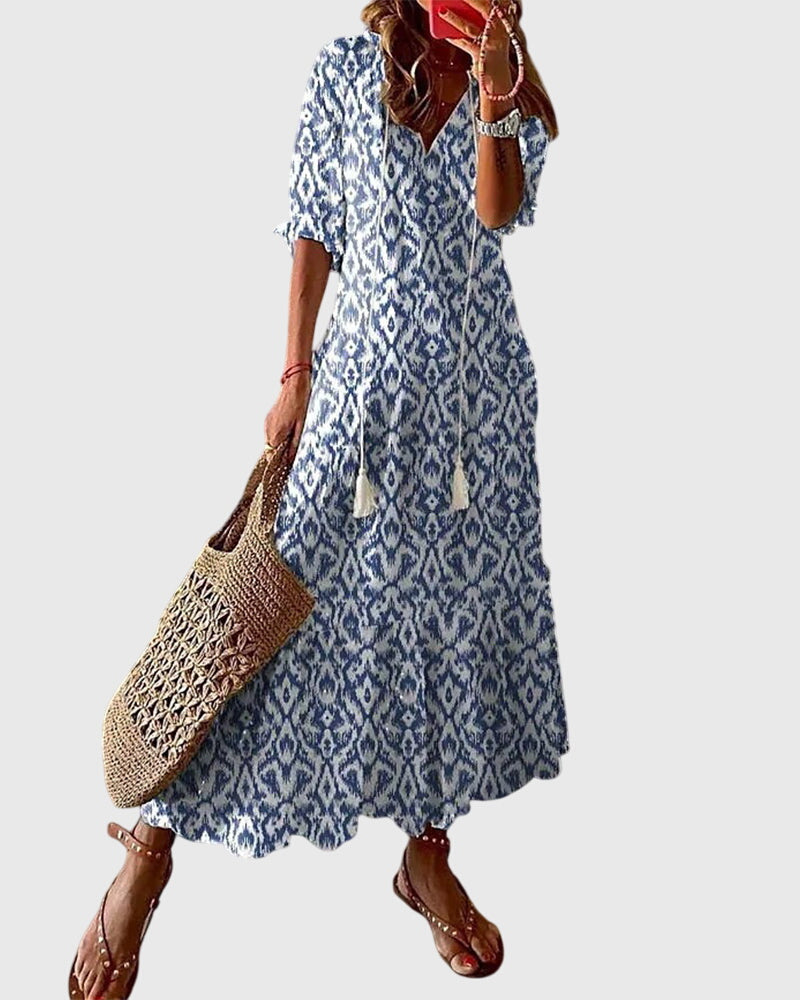 Elegantes Damen Boho Sommerkleid im Vintage-Stil für Freizeit & Urlaub, mit Blumenmuster und V-Ausschnitt.