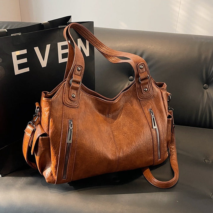 Stilvolle schwarze Damentasche. Ideal als geräumige Schultertasche, Sporttasche oder Wochenendtasche.