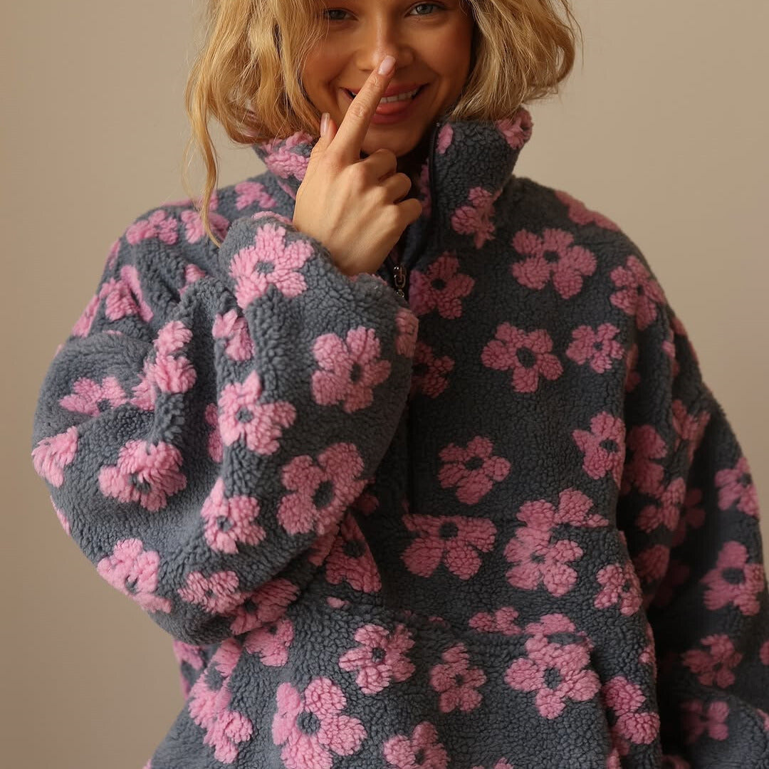 Gelb-rosa-oranger Damenpullover mit stilvollem Blumenmuster. Warmes und weiches Langarm-Oberteil.