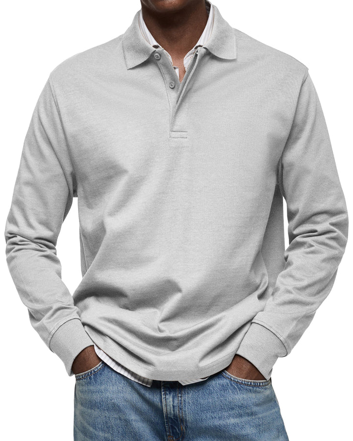 Klassisches Herren Langarm-Poloshirt, figurbetont geschnitten, mit stilvollem Strukturkragen.