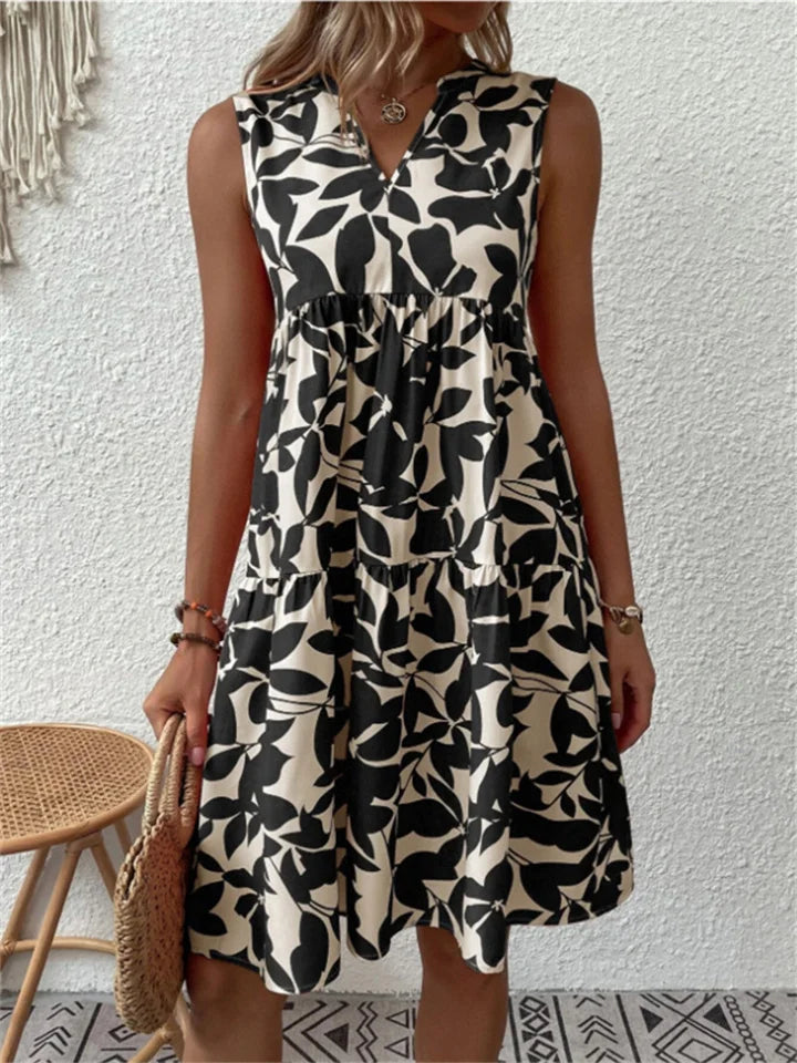Damen Maxikleid in A-Linie, V-Ausschnitt, ärmellos; mit farbigem Blumenmuster für elegante Sommeroutfits.
