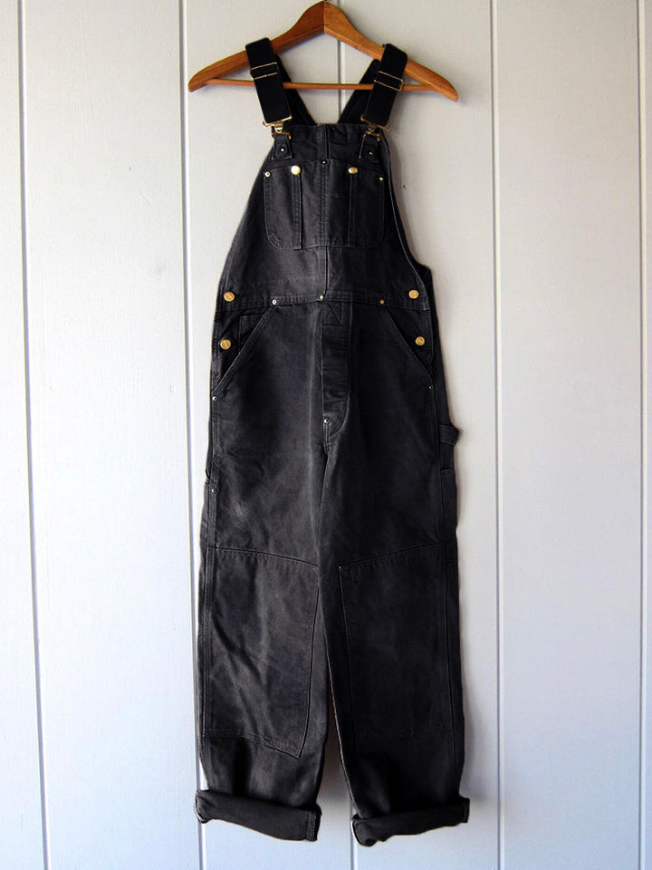 Detailansicht der Damen Vintage Latzhose (Schwarz): praktische Taschen, bequeme Passform für Komfort.