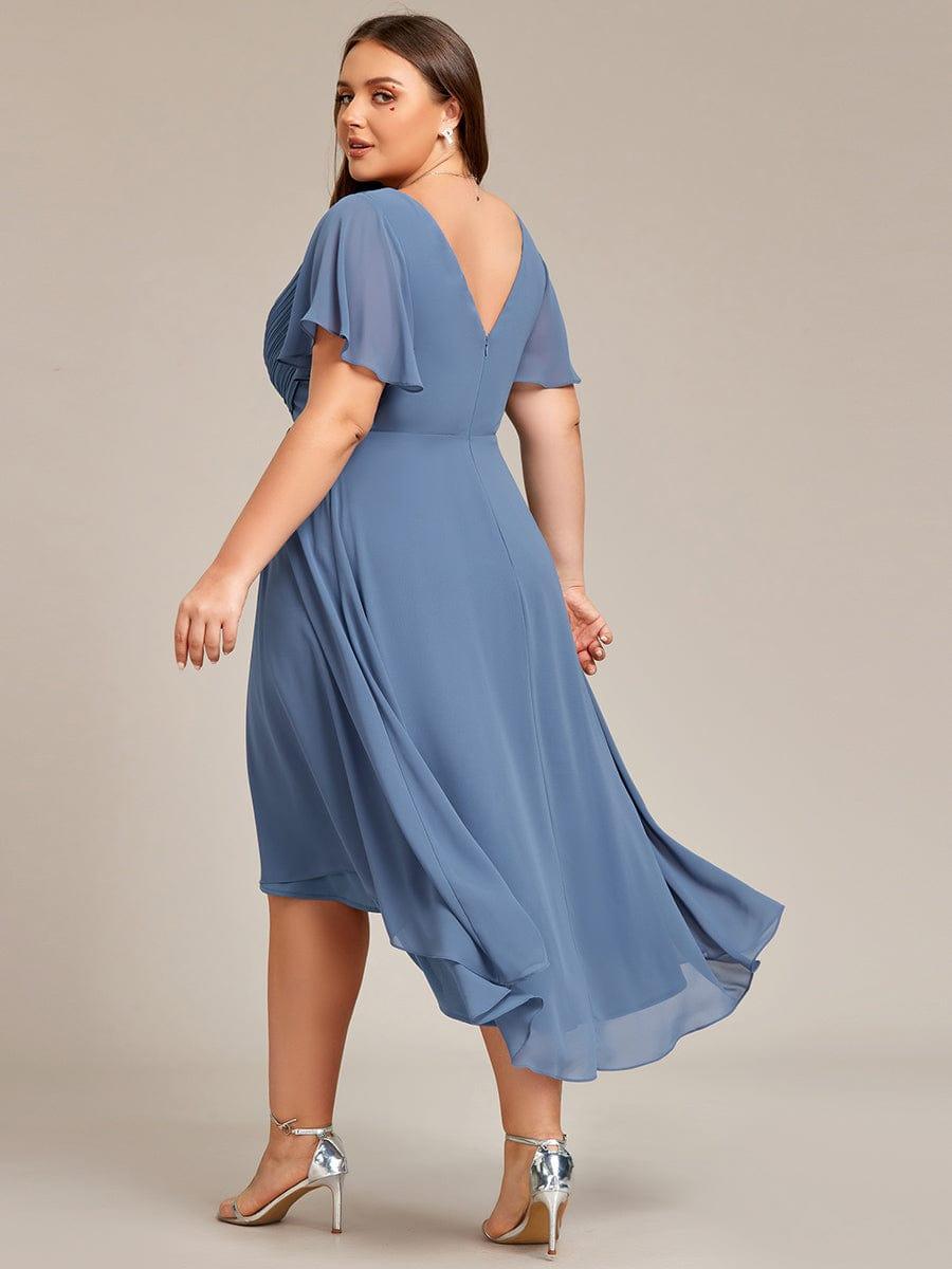 Elegantes Hochzeitsgastkleid Vokuhila, Kurzarm, Midi-Länge, für einen festlichen Auftritt.