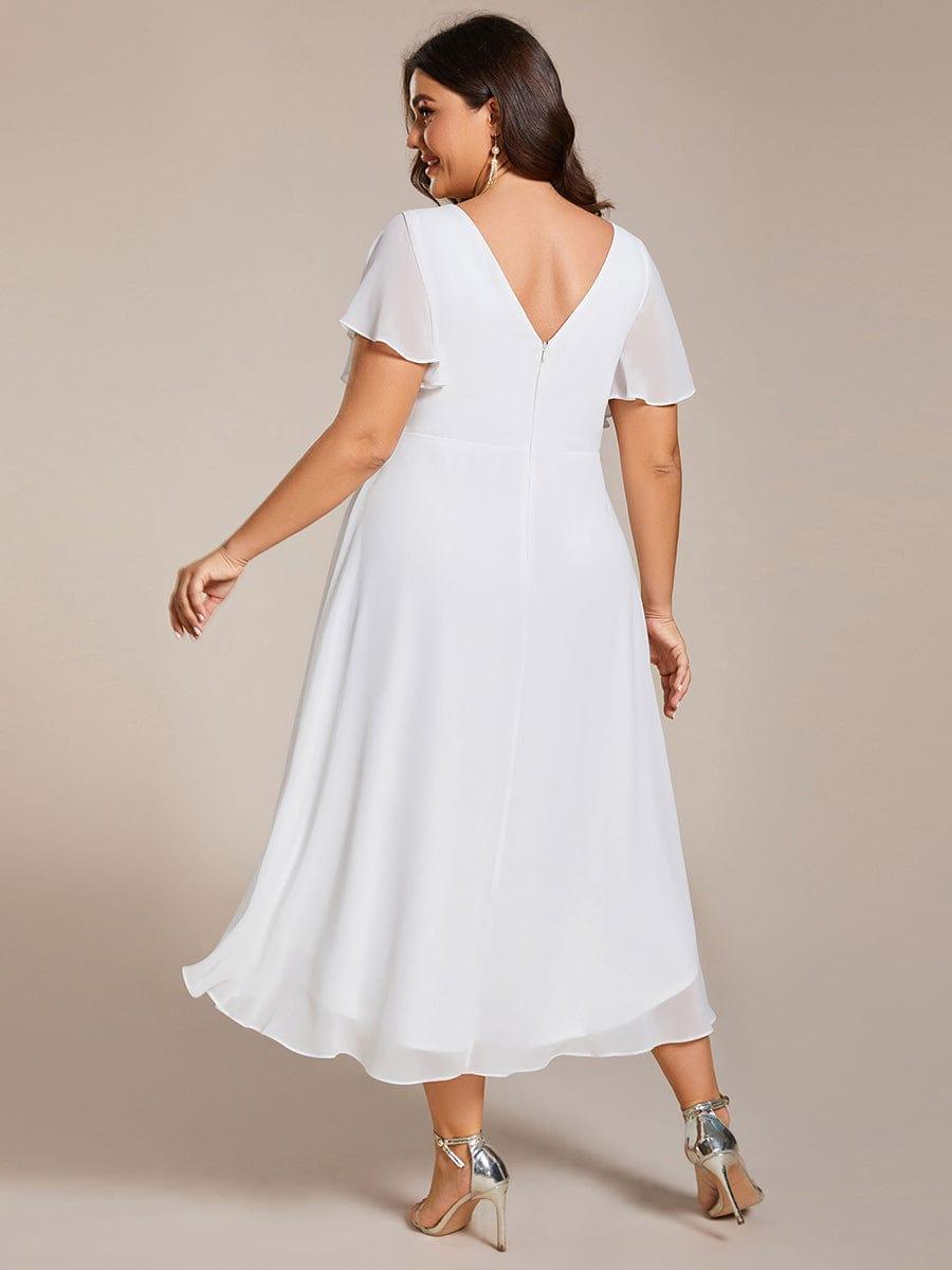 Stilvolles Vokuhila Cocktailkleid, Kurzarm, Midi-Länge, elegant für jede Feier.