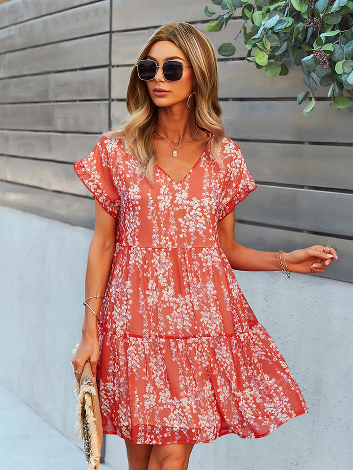 Damen A-Linien-Kleid mit Blumenmuster, V-Ausschnitt, elegant und komfortabel für festliche Anlässe.