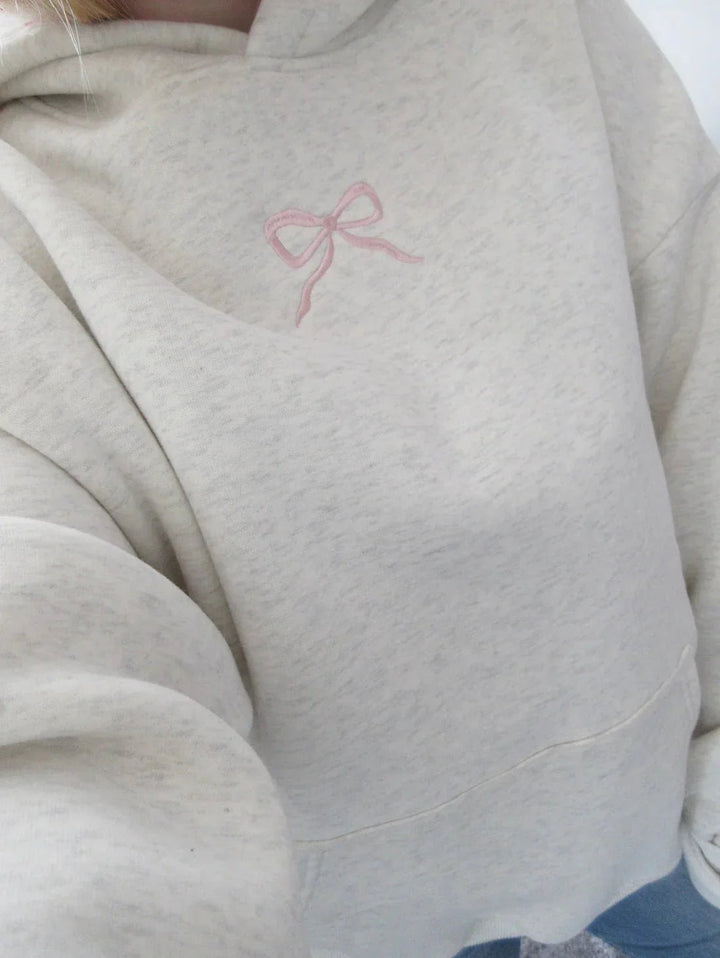 Elfenbein Damen Hoodie mit Kapuze und süßen rosa Schleifen; gemütlicher Kapuzenpullover für Freizeit & Alltag.
