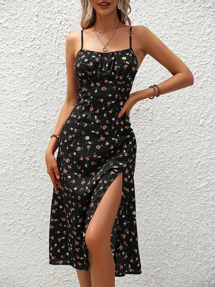 Damen Sommer Midikleid mit Blumenprint, Spaghettiträgern und fließender A-Linie.