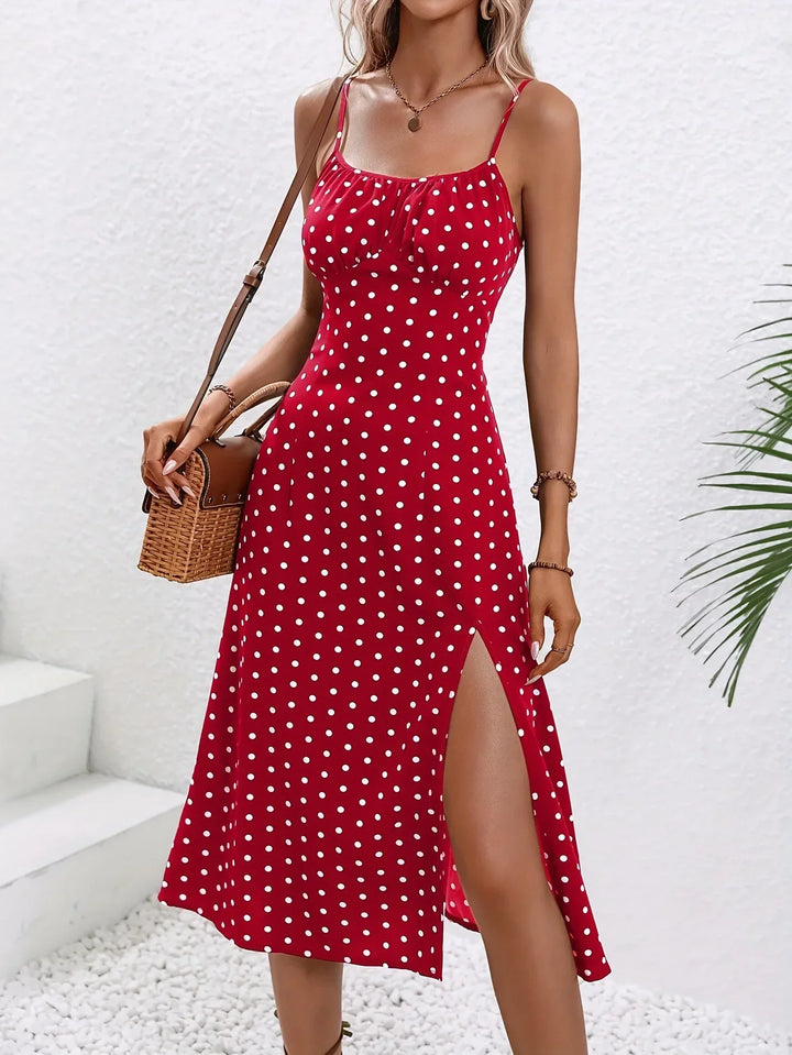 Bedrucktes Damen Midikleid mit feinen Spaghettiträgern, leichter Stoff und elegantem Fall.