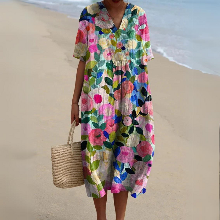 Leichtes Damen Sommerkleid mit Blumenmuster. Fließend, V-Ausschnitt, perfekt für Urlaub & Strand.