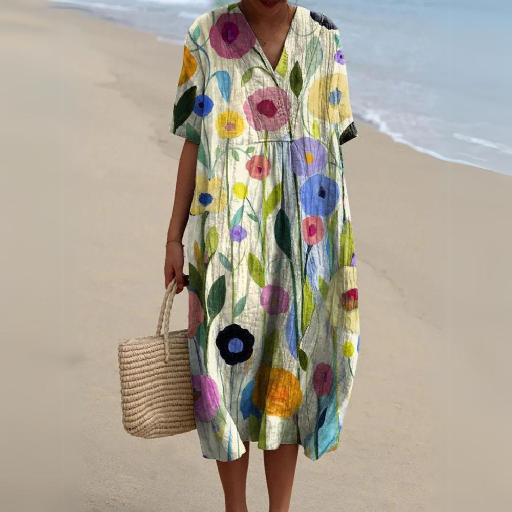 Elegantes Damen Blumen Midikleid im Boho-Stil. Fließender Stoff, V-Ausschnitt, vielseitig für Sommer.