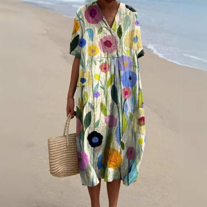 Elegantes Damen Blumen Midikleid im Boho-Stil. Fließender Stoff, V-Ausschnitt, vielseitig für Sommer.