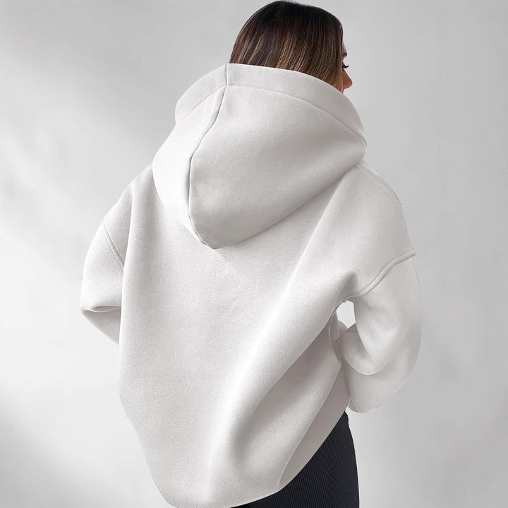 Femininer Langarm Kapuzenpullover für Damen. V-Ausschnitt & lockere Passform. Ideal für Herbstmode.