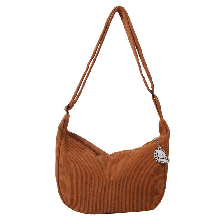 Elegante SandsBerg Schultertasche für Damen, farbig, vielseitig & mit charmantem Anhänger.
