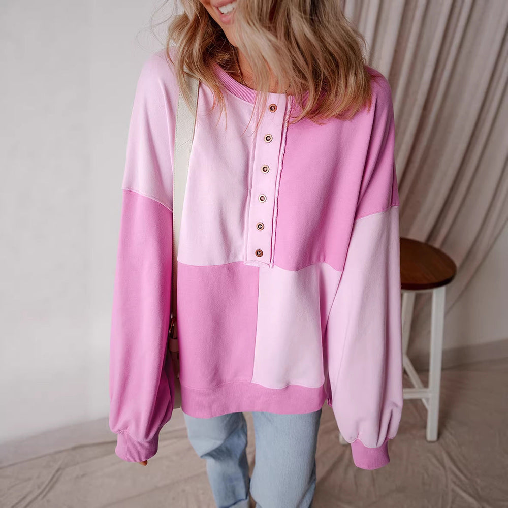 Modisches Damen Colorblock Oversize-Sweatshirt mit Henley-Ausschnitt, geripptem Saum, ideal für Streetstyle.