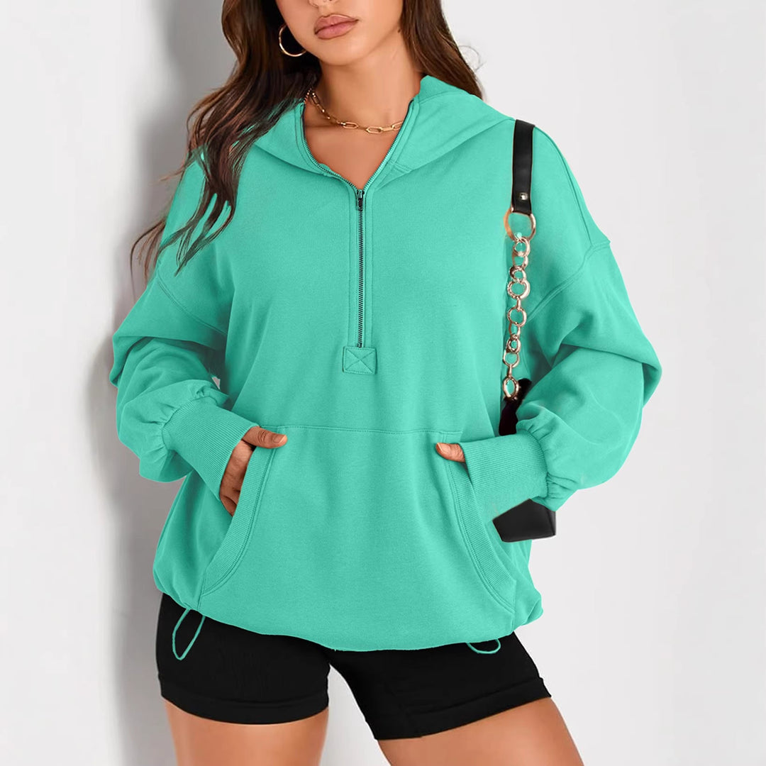 Sportlicher Damen Kapuzenpullover, Oversize, mit Halbzip, Tunnelzug & praktischer Kängurutasche.