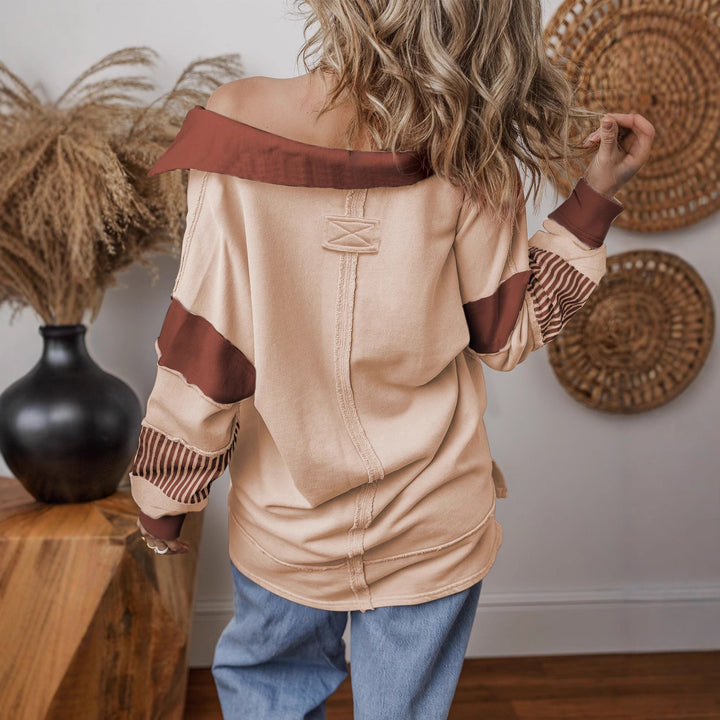 Stylisches Damen Sweatshirt mit auffälligen Streifen & bequemem Oversize-Schnitt. Tiefer V-Ausschnitt.