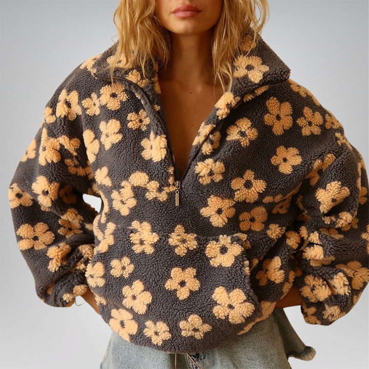 Locker geschnittener Damenpullover mit Herbstblumenmuster. Ideal als bequemes Langarm-Oberteil.