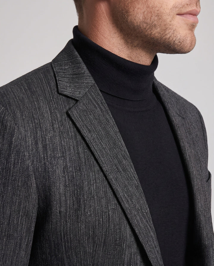 Hochwertiger Stoff des Herren Stretch Blazers. Detailansicht der feinen Textur für Eleganz und Tragekomfort.