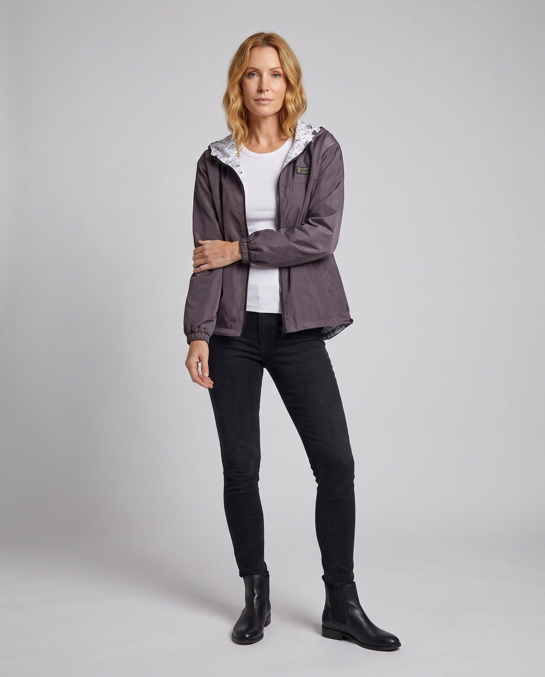 Unisex leichter Kapuzenwindbreaker mit stylischem bedruckten Innenfutter. Ideal als Übergangs- & Freizeitjacke.