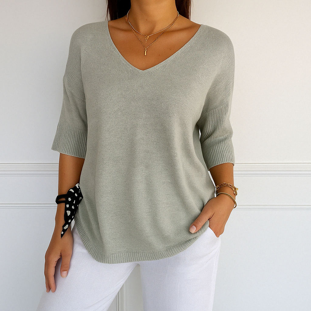 Eleganter Damen Basic-Pullover mit kurzen Ärmeln und V-Ausschnitt. Lockere Passform, perfekt für den Sommer.