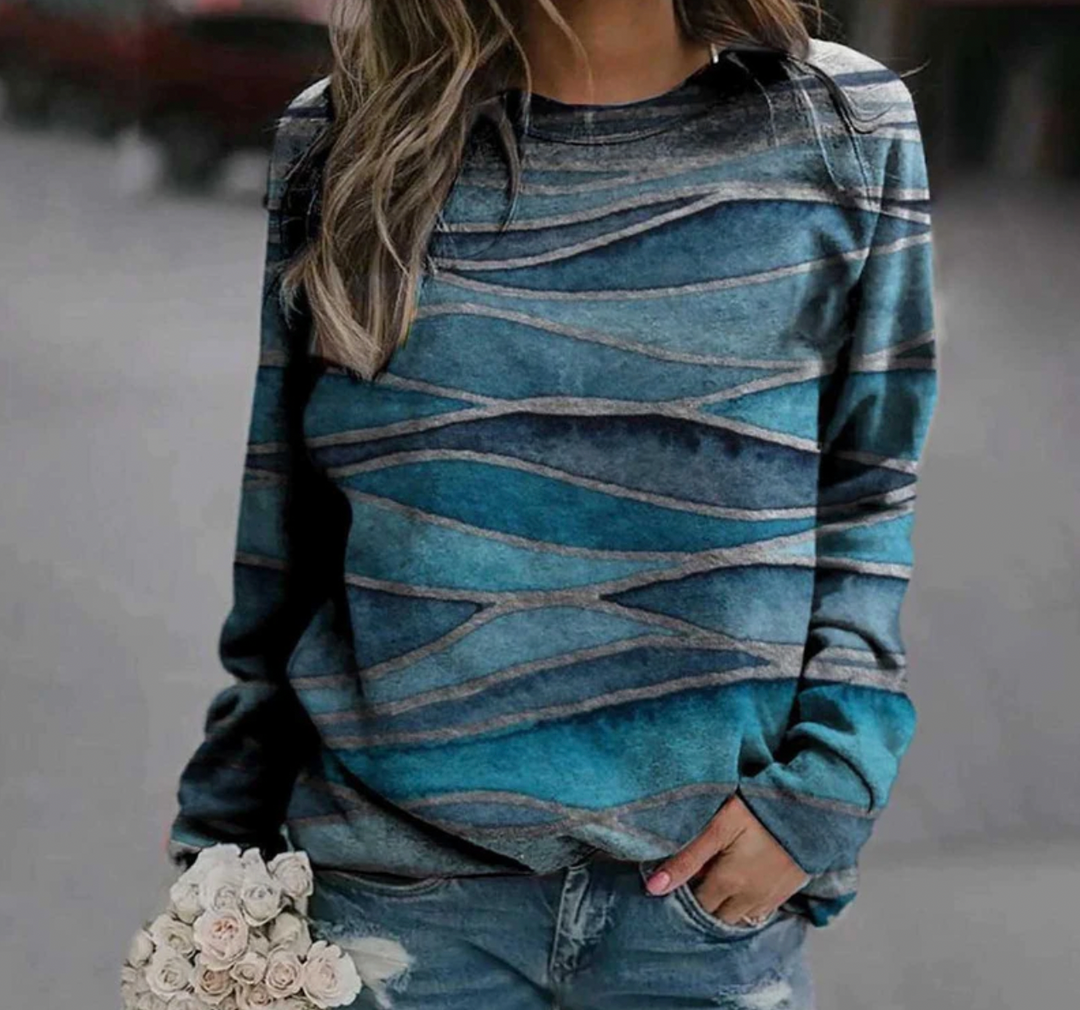 Stylischer Damen Winter Pullover mit künstlerischem Druck. Lockere Passform, warmer Rundhals für gemütliche Tage.