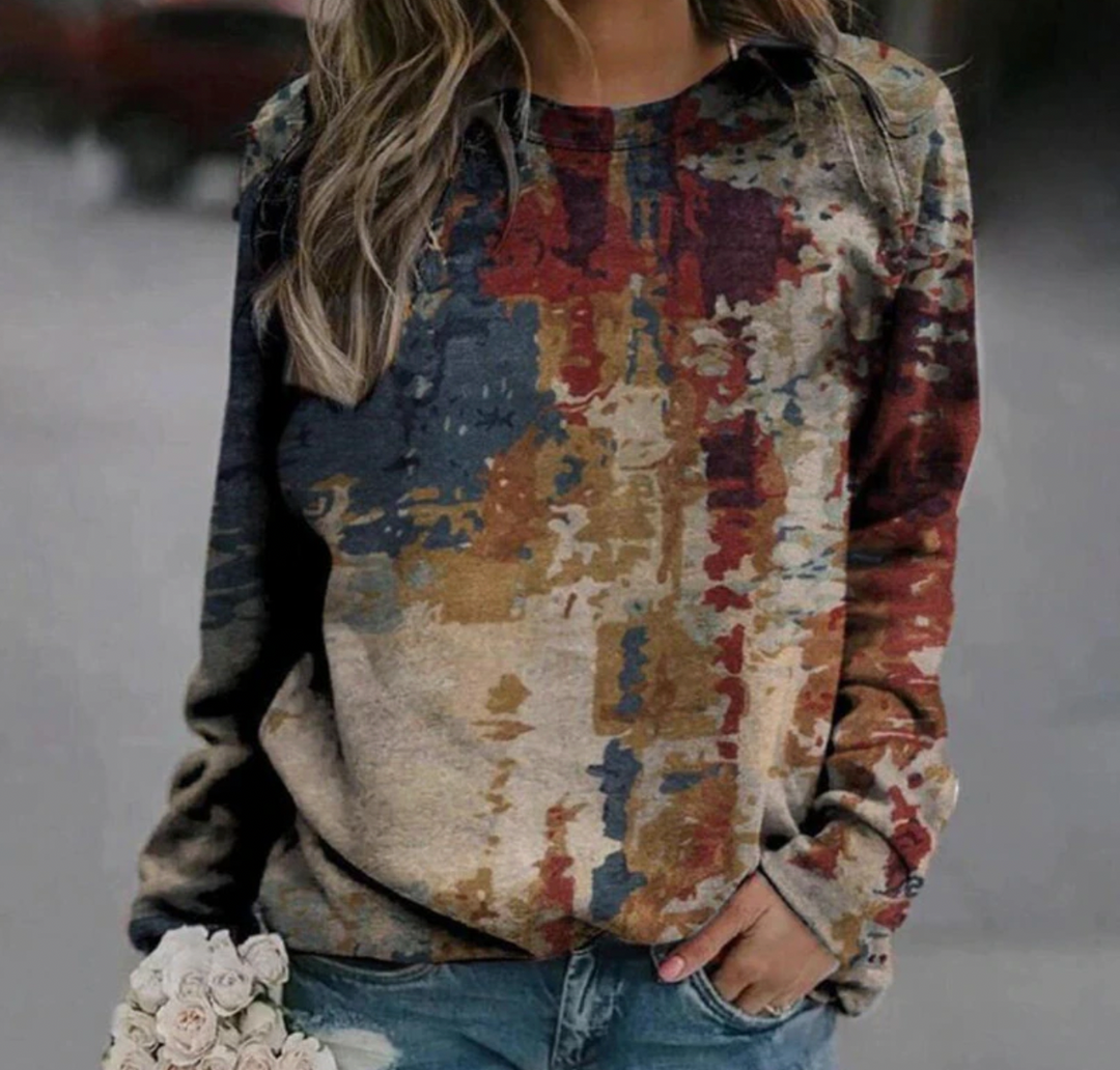 Gemütlicher Damen Strickpullover mit einzigartigem Kunstprint. Bequemer Rundhals für Herbst und kalte Wintertage.