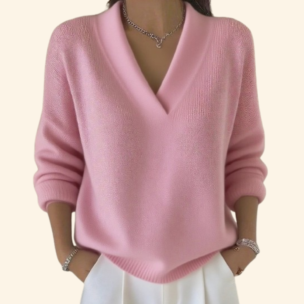Eleganter rosa Damen Pullover mit V-Ausschnitt. Vielseitiges, langärmliges Oberteil für gemütliche Herbst-Looks.