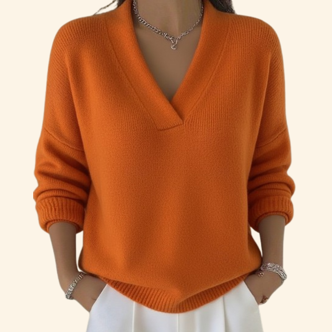 Gemütlicher orange Damen Pullover mit V-Ausschnitt. Eleganter lockerer Schnitt, langarm, perfekt für kalte Tage.