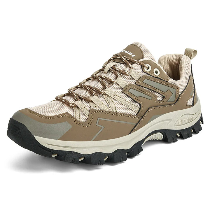 Seitliche Ansicht robuster rosa-weißer Damen Outdoor Schuhe mit griffiger, rutschfester Sohle.