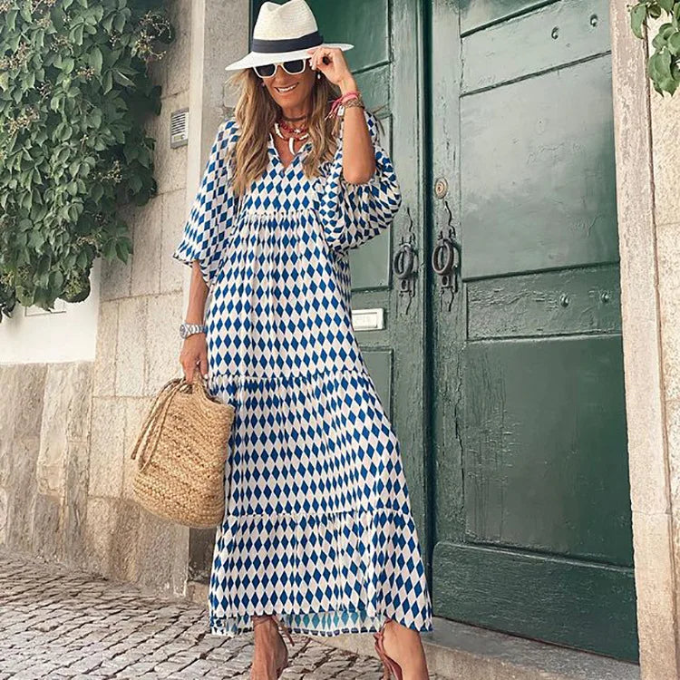 Bedrucktes Damen Sommer Maxikleid mit lebhaftem Blumenmuster, Rüschen und V-Ausschnitt; ideal als Freizeitkleid.